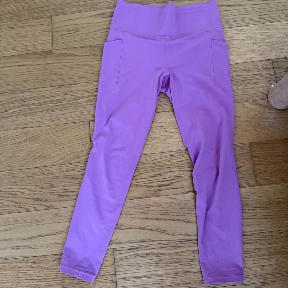 Athleta Salutation Stash Tight (size medium)